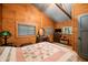 Bedroom featuring a queen bed, hardwood floors, dresser, and windows for natural light at 2781 E Vandalia Rd, Flat Rock, IN 47234
