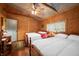 Bedroom with hardwood floors featuring two beds and natural light through the windows at 2781 E Vandalia Rd, Flat Rock, IN 47234