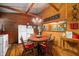 Kitchen and dining area with wood accents, charming vintage fixtures and retro refrigerator at 2781 E Vandalia Rd, Flat Rock, IN 47234