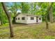 Exterior showing a bright exterior paint, natural light, and lush greenery at 2781 E Vandalia Rd, Flat Rock, IN 47234