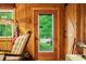 Interior view with a charming door and a window, complemented by cozy decor and natural light at 2781 E Vandalia Rd, Flat Rock, IN 47234