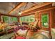 Comfortable living room with natural wood, cathedral ceilings, ceiling fan, and ample natural light at 2781 E Vandalia Rd, Flat Rock, IN 47234