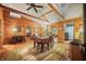 Open floor plan with wood walls, dining area, desk, and easy access to other rooms at 2781 E Vandalia Rd, Flat Rock, IN 47234