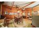 Spacious living space with wood-paneled walls, dining area, and access to bedroom at 2781 E Vandalia Rd, Flat Rock, IN 47234