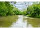 Scenic river view surrounded by lush greenery under a partly cloudy sky at 2781 E Vandalia Rd, Flat Rock, IN 47234
