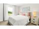 Bright bedroom with decorative accents, soft lighting, and a scenic window view at 2922 Woods Edge Dr, Greenwood, IN 46143