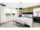 This bright bedroom features an accent wall, a pendant lamp, and large windows with a water view at 2922 Woods Edge Dr, Greenwood, IN 46143