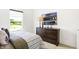 Cozy bedroom featuring a dark wood dresser with scenic outdoor views at 2922 Woods Edge Dr, Greenwood, IN 46143
