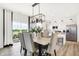 Bright dining area open to the kitchen and backyard, complete with sleek appliances and stylish seating at 2922 Woods Edge Dr, Greenwood, IN 46143