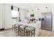 Bright kitchen features stainless steel appliances, quartz countertops, seating, and an open concept at 2922 Woods Edge Dr, Greenwood, IN 46143