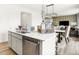Bright kitchen island features stainless steel appliances, quartz countertops, and an open floor plan at 2922 Woods Edge Dr, Greenwood, IN 46143