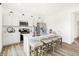 Bright kitchen features stainless steel appliances, quartz countertops, seating, and ample cabinet space at 2922 Woods Edge Dr, Greenwood, IN 46143
