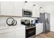 Kitchen features stainless steel appliances, quartz countertops, and sleek cabinetry at 2922 Woods Edge Dr, Greenwood, IN 46143