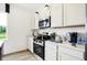 Kitchen features stainless steel appliances, quartz countertops, and white cabinetry at 2922 Woods Edge Dr, Greenwood, IN 46143