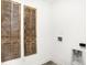 Laundry room with decorative wood shutters, utility sink, and electric hookups at 2922 Woods Edge Dr, Greenwood, IN 46143