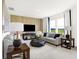 Bright living room features neutral decor, accent wall, and large windows, creating an inviting space at 2922 Woods Edge Dr, Greenwood, IN 46143