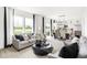 Bright living room with large windows offering a great view of the landscape at 2922 Woods Edge Dr, Greenwood, IN 46143