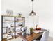 Cozy home office featuring a rustic wooden desk, decorative shelving and great lighting at 2922 Woods Edge Dr, Greenwood, IN 46143