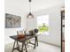 Bright home office with a large window overlooking the community and a stylish wooden desk at 2922 Woods Edge Dr, Greenwood, IN 46143