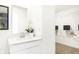 Well-lit bathroom featuring a white vanity, walk-in closet, and modern fixtures at 2948 Woods Edge Dr, Greenwood, IN 46143
