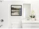 Modern bathroom with white cabinets, a clean sink, and a shower-tub combo at 2948 Woods Edge Dr, Greenwood, IN 46143