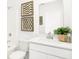 A bright bathroom with white cabinets and decor at 2948 Woods Edge Dr, Greenwood, IN 46143