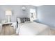 Comfortable bedroom with an abundance of natural light, two lamps and simple decor at 2948 Woods Edge Dr, Greenwood, IN 46143