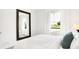 Relaxing bedroom features a large window and a full-length mirror at 2948 Woods Edge Dr, Greenwood, IN 46143