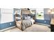 Bedroom with wooden bunk beds, two large windows with a view at 2948 Woods Edge Dr, Greenwood, IN 46143