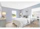 A bright bedroom with an abundance of natural light, two lamps and clean simple decor at 2948 Woods Edge Dr, Greenwood, IN 46143