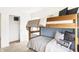 Bedroom with wooden bunk beds, a view from the window, and a closet at 2948 Woods Edge Dr, Greenwood, IN 46143