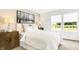 Well-lit bedroom featuring an accent wall, large windows, and a neutral color palette at 2948 Woods Edge Dr, Greenwood, IN 46143