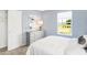 A bedroom in soft light blue with a closet and dresser at 2948 Woods Edge Dr, Greenwood, IN 46143
