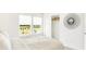 Bright bedroom featuring a large window with a view, closet, and minimalist modern decor at 2948 Woods Edge Dr, Greenwood, IN 46143