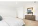 Bright bedroom featuring neutral walls, carpet, and a decorative mirror at 2948 Woods Edge Dr, Greenwood, IN 46143
