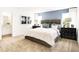 Comfortable bedroom featuring carpet floors, a large bed, and a blue accent wall at 2948 Woods Edge Dr, Greenwood, IN 46143