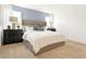 Bright bedroom with a large bed, soft carpet, and large windows with natural light at 2948 Woods Edge Dr, Greenwood, IN 46143