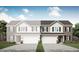 Two-story townhome showing brick and siding front with attached garage and neutral color palette at 2948 Woods Edge Dr, Greenwood, IN 46143