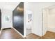 View of front door, foyer, wood-look flooring and view into bedroom and bathroom at 2948 Woods Edge Dr, Greenwood, IN 46143