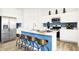 Kitchen view showing white cabinets, stainless steel appliances, and blue island with barstool seating at 2948 Woods Edge Dr, Greenwood, IN 46143