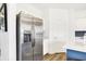 Stainless steel refrigerator in a bright kitchen with modern fixtures, with white countertops and white cabinets at 2948 Woods Edge Dr, Greenwood, IN 46143