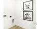 Bright white laundry room decorated with framed animal portraits at 2948 Woods Edge Dr, Greenwood, IN 46143
