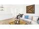 Cozy living room features neutral tones, comfortable seating, and stylish wood accents at 2948 Woods Edge Dr, Greenwood, IN 46143