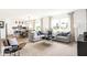 Spacious living room that opens to the kitchen and dining areas featuring neutral tones and lots of natural light at 2948 Woods Edge Dr, Greenwood, IN 46143