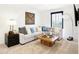Bright living room features neutral tones, large sectional, and stylish wood accents at 2948 Woods Edge Dr, Greenwood, IN 46143