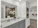 Bathroom featuring double sinks with quartz countertops and an open doorway to the shower at 3104 Glasgow Pl, Danville, IN 46122