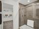 Elegant bathroom boasting a glass shower enclosure and an adjacent walk-in closet at 3104 Glasgow Pl, Danville, IN 46122