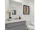Clean bathroom featuring a stylish vanity with quartz countertop, modern faucet, and neutral decor at 3104 Glasgow Pl, Danville, IN 46122