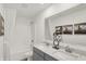 Well-lit bathroom with double vanity sinks, modern fixtures, and shower-tub combination at 3104 Glasgow Pl, Danville, IN 46122