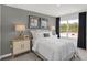 Serene bedroom with a queen bed, decorative lamps, and coordinated wall art at 3104 Glasgow Pl, Danville, IN 46122